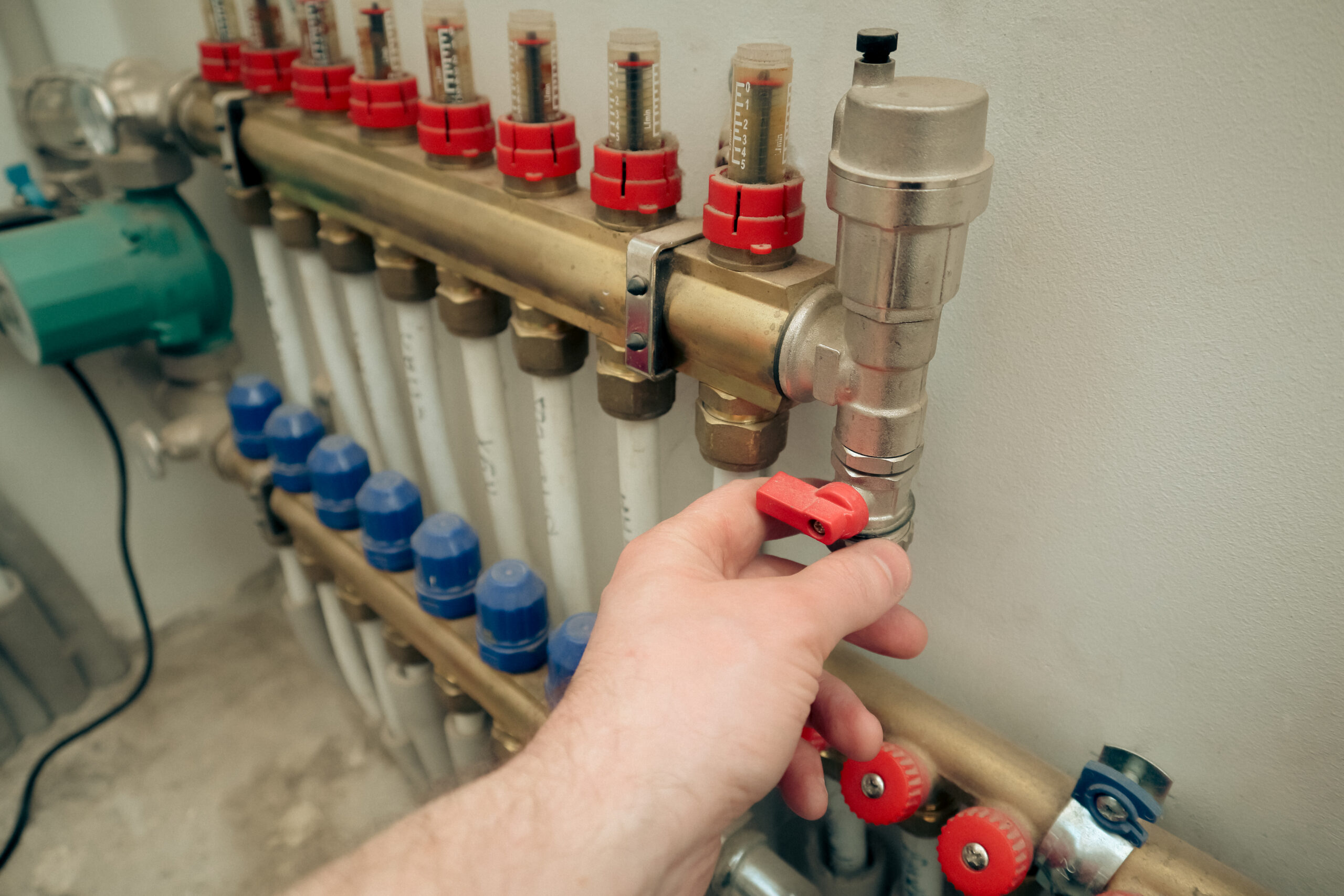 Plumber at work, plumbing repair service, assemble and install concept. Plumber fixing central heating system